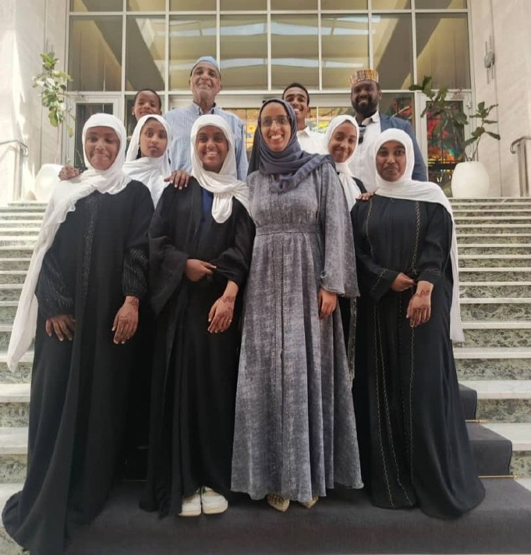 Students, families, and community members pose together at UNECA during the International Arabic Language Day celebration.