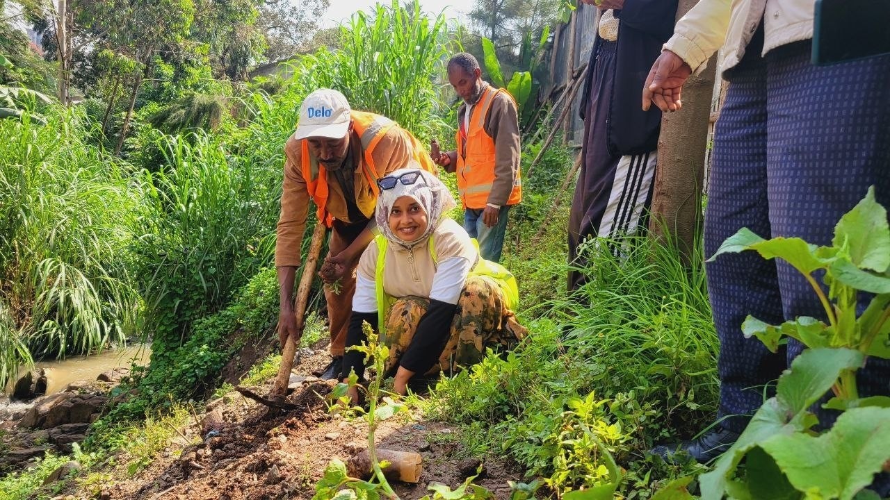 Abadir staff planting trees for the Green Legacy Initiative