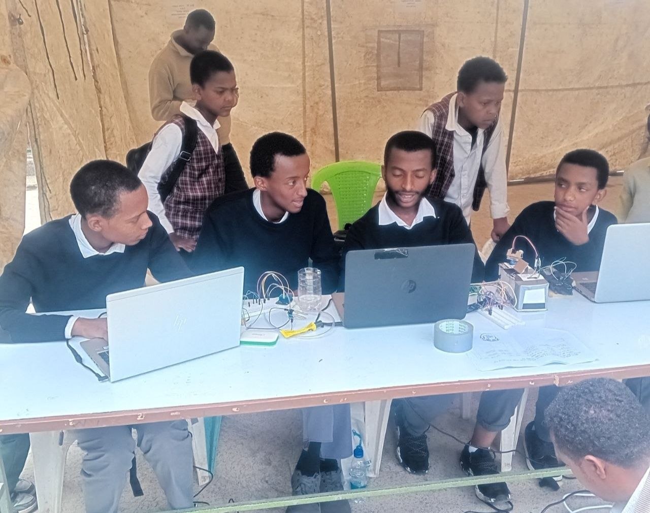 Mekanisa Abadir School students work on laptops and electronics at the Science and Innovation Exhibition.